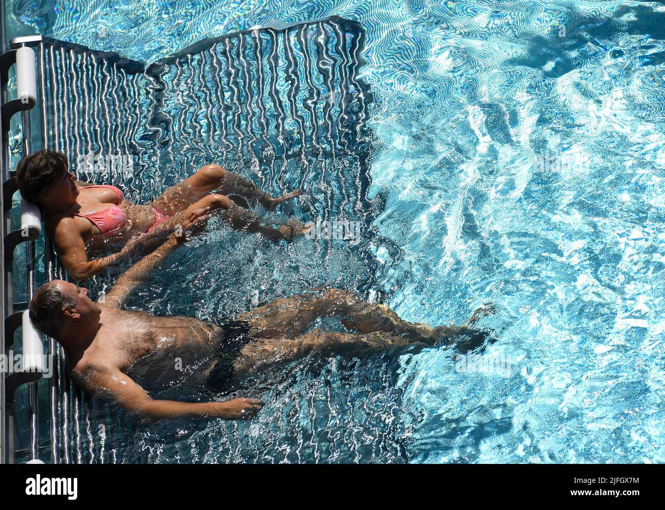 Karlovy Vary, Czech Republic. 03rd July, 2022. The 56th Karlovy Vary International Film Festival continues on July 3rrd, 2022, Karlovy Vary, Czech Republic. People swim in the pool of the festival's Thermal Hotel. Credit: Katerina Sulova/CTK Photo/Alamy Live News Stock Photo