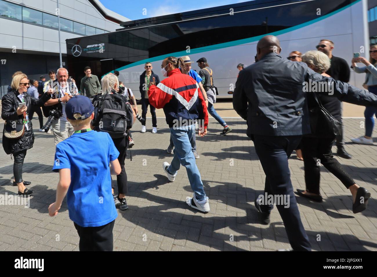 3rd July 2022,  Silverstone Circuit, Silverstone, Northamptonshire, England: British F1 Grand Prix, Race day: Mercedes AMG Petronas F1 Team, Lewis Hamilton arrives to the paddock and crowds surround him to try and get a selfie Stock Photo