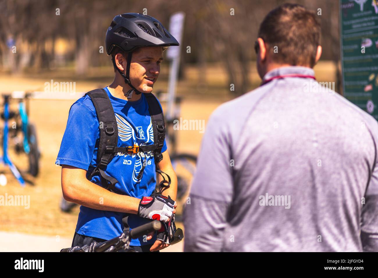 A Caucasian man getting ready to ride a bike in a race held in the DFW metroplex in Texas Stock Photo