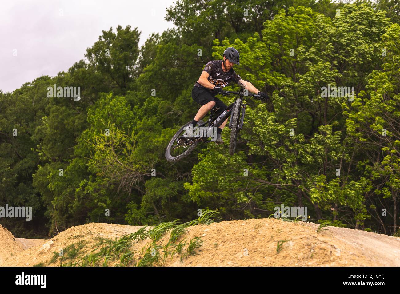A Caucasian man riding a bike in a race held in the DFW metroplex in Texas Stock Photo