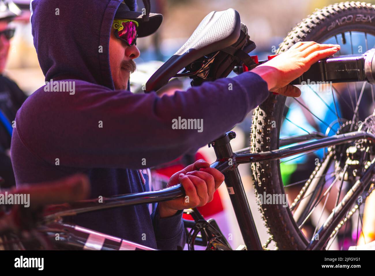A Caucasian man getting ready to ride a bike in a race held in the DFW metroplex in Texas Stock Photo