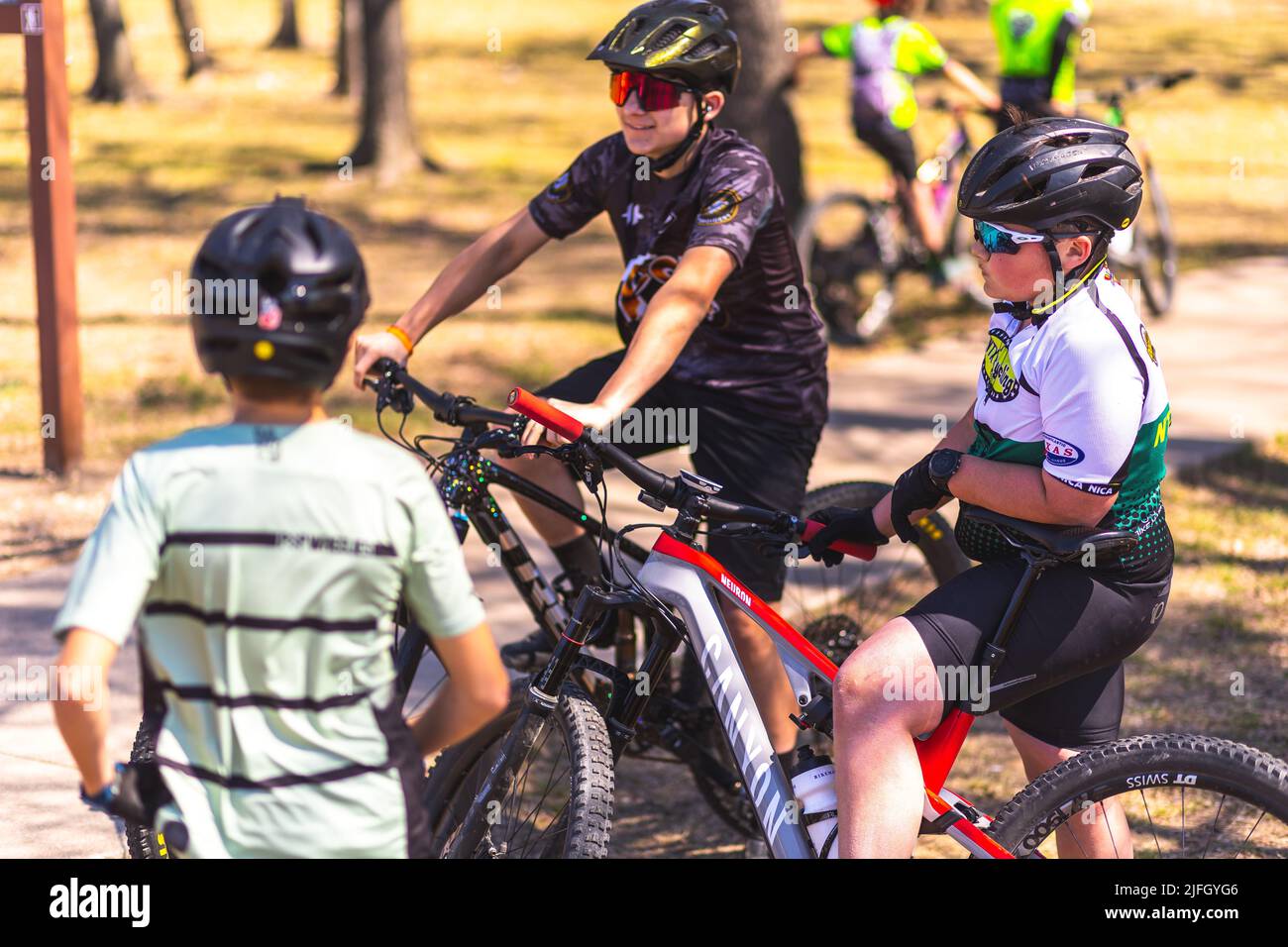 A Caucasian boy getting ready to ride a bike in a race held in the DFW metroplex in Texas Stock Photo