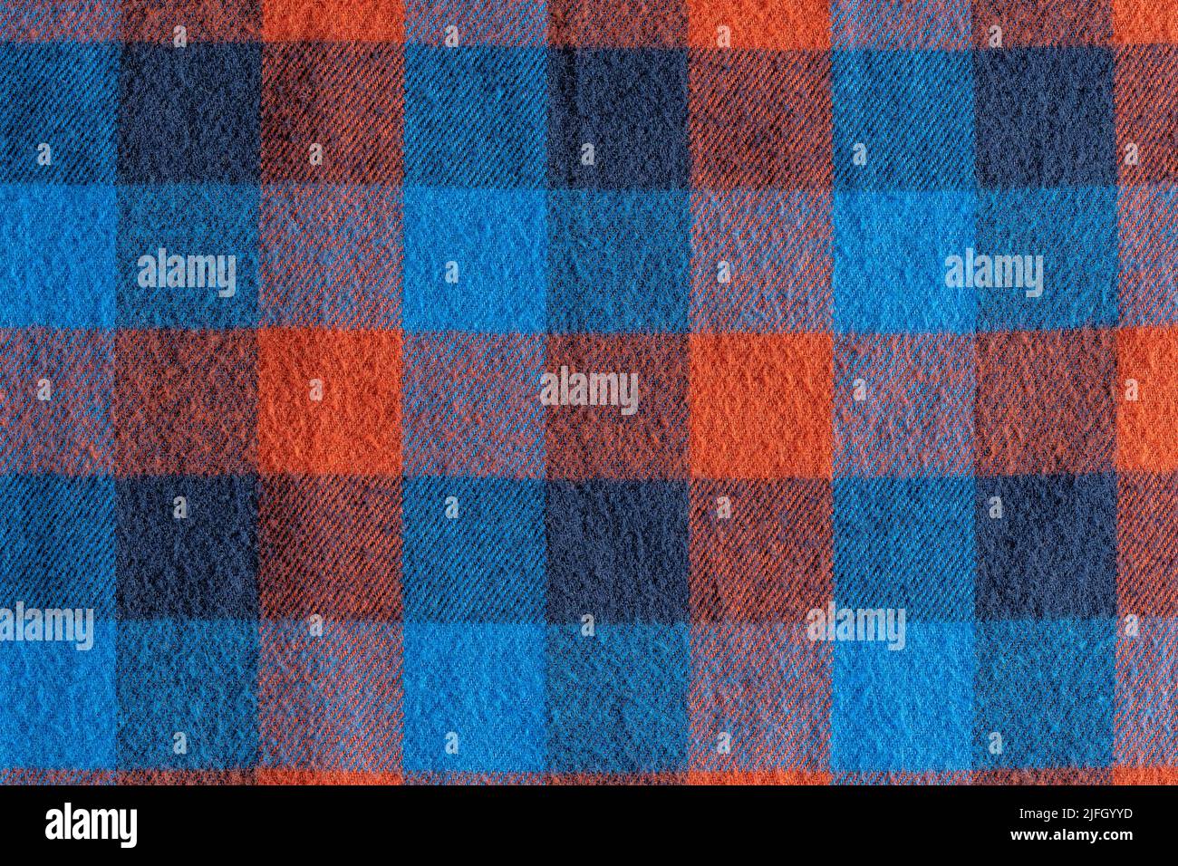 An abstract blue and red checkered fabric background or texture Stock Photo