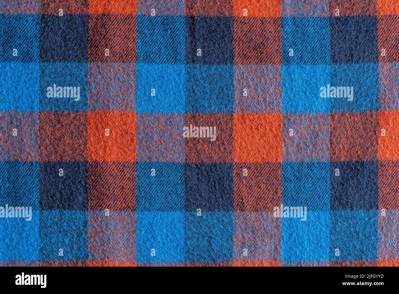 An abstract blue and red checkered fabric background or texture Stock ...