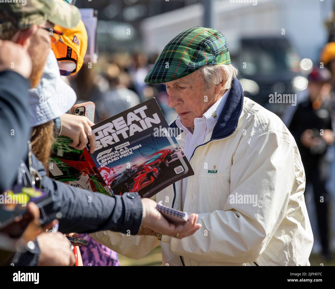 Silverstone, UK. 3rd July 2022, Silverstone Circuit, Silverstone, Northamptonshire, England: British F1 Grand Prix, Race day: Sir Jackie Stewart signs a autograph Credit: Action Plus Sports Images/Alamy Live News Stock Photo