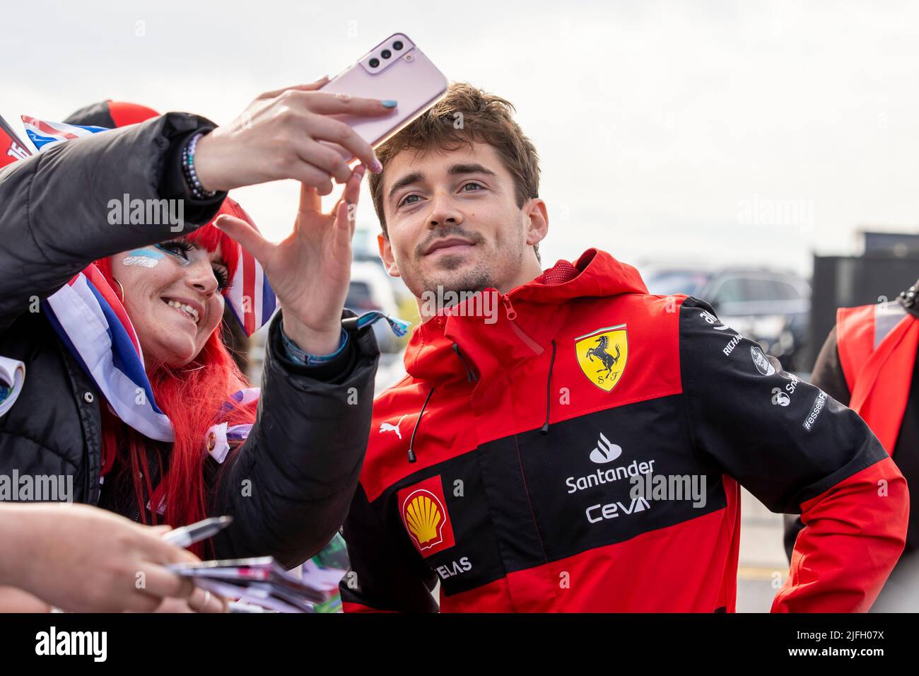 Silverstone, UK. 3rd July 2022, Silverstone Circuit, Silverstone, Northamptonshire, England: British F1 Grand Prix, Race day: Scuderia Ferrari driver Charles Leclerc poses for a selfie Credit: Action Plus Sports Images/Alamy Live News Stock Photo
