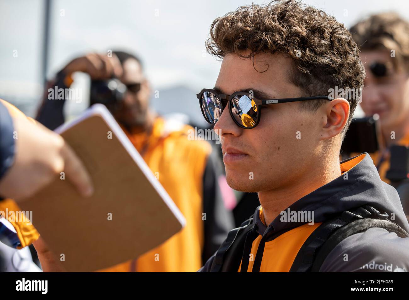 Silverstone, UK. 3rd July 2022, Silverstone Circuit, Silverstone, Northamptonshire, England: British F1 Grand Prix, Race day: McLaren F1 Team driver Lando Norris signs fans autographs Credit: Action Plus Sports Images/Alamy Live News Stock Photo