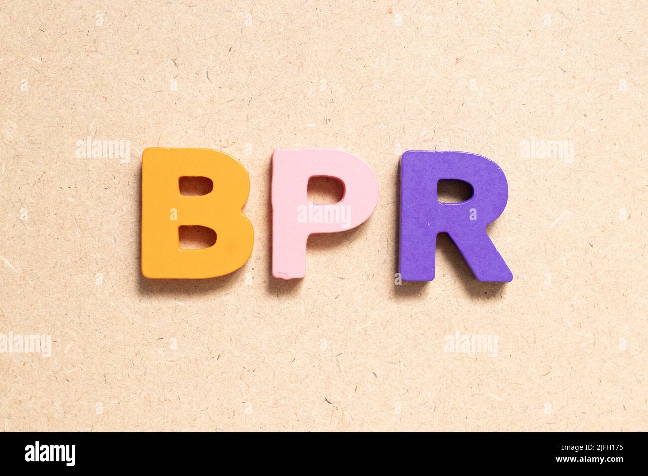 Color alphabet letter in word BPR (Abbreviation of Business Process Reengineering or Batch processing record) on wood background Stock Photo