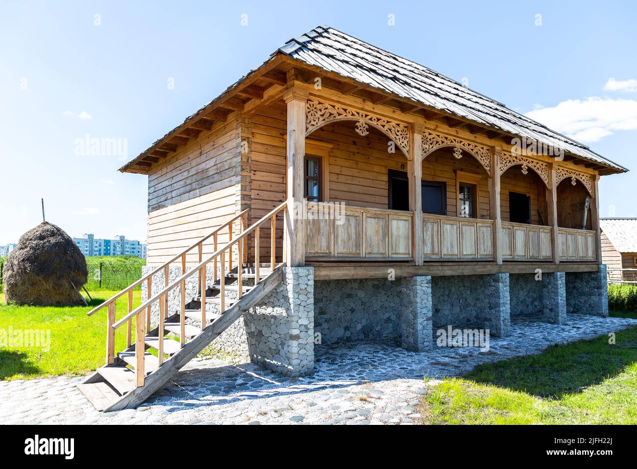 Samara, Russia - June 25, 2022: Ethnocultural complex 'People's Friendship Park'. Traditional Osetinian house from wooden logs and stones Stock Photo