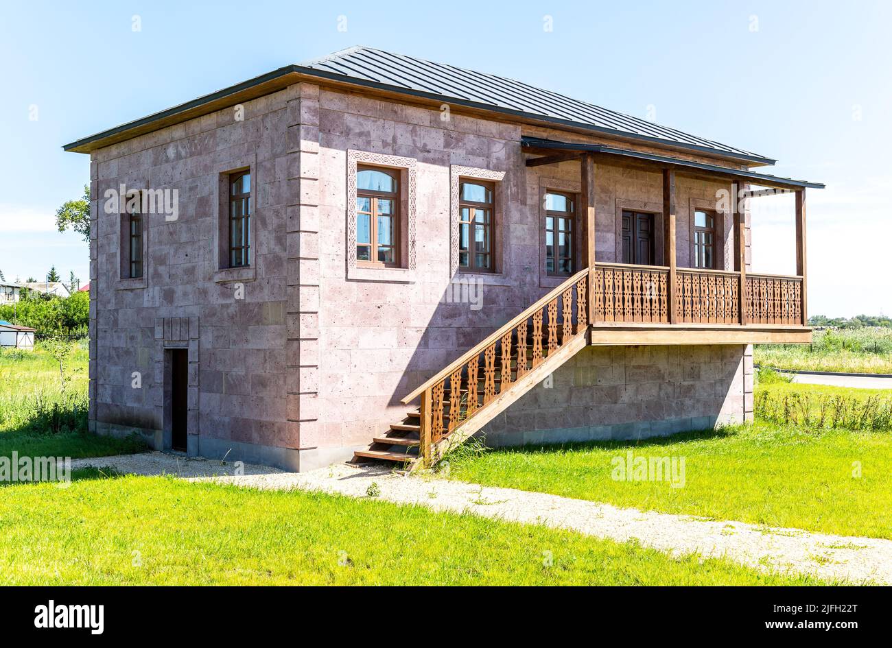 Samara, Russia - June 25, 2022: Ethnocultural complex 'People's Friendship Park'. Traditional Armenian house from stones. Armenian farmstead in summer Stock Photo