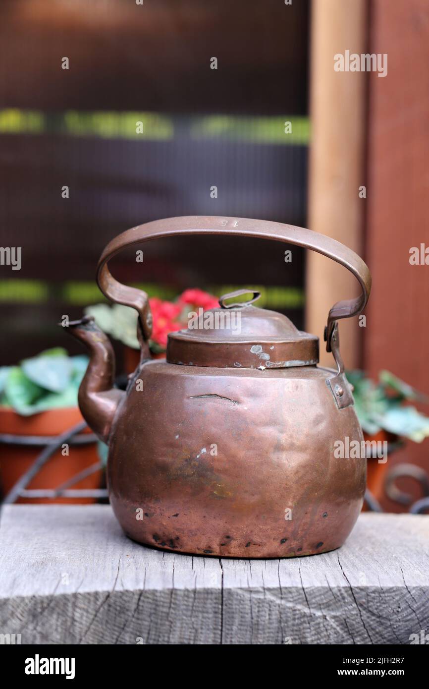 Old copper teapot photographed in a Finnish summer cottage during