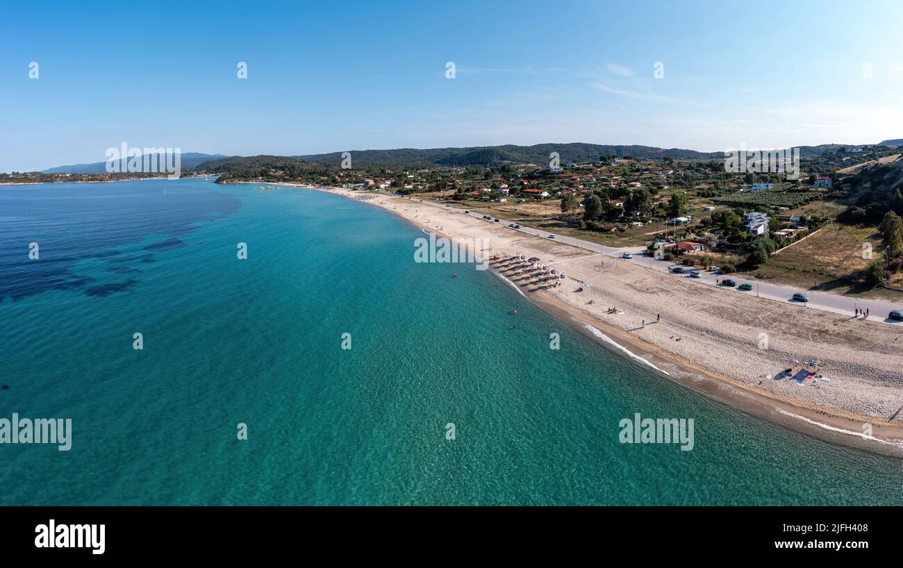 Sithonia Chalkidiki, Greece. Ormos Panagias bay aerial drone view, sandy beach and clear blue sky, sunny summer day. Stock Photo