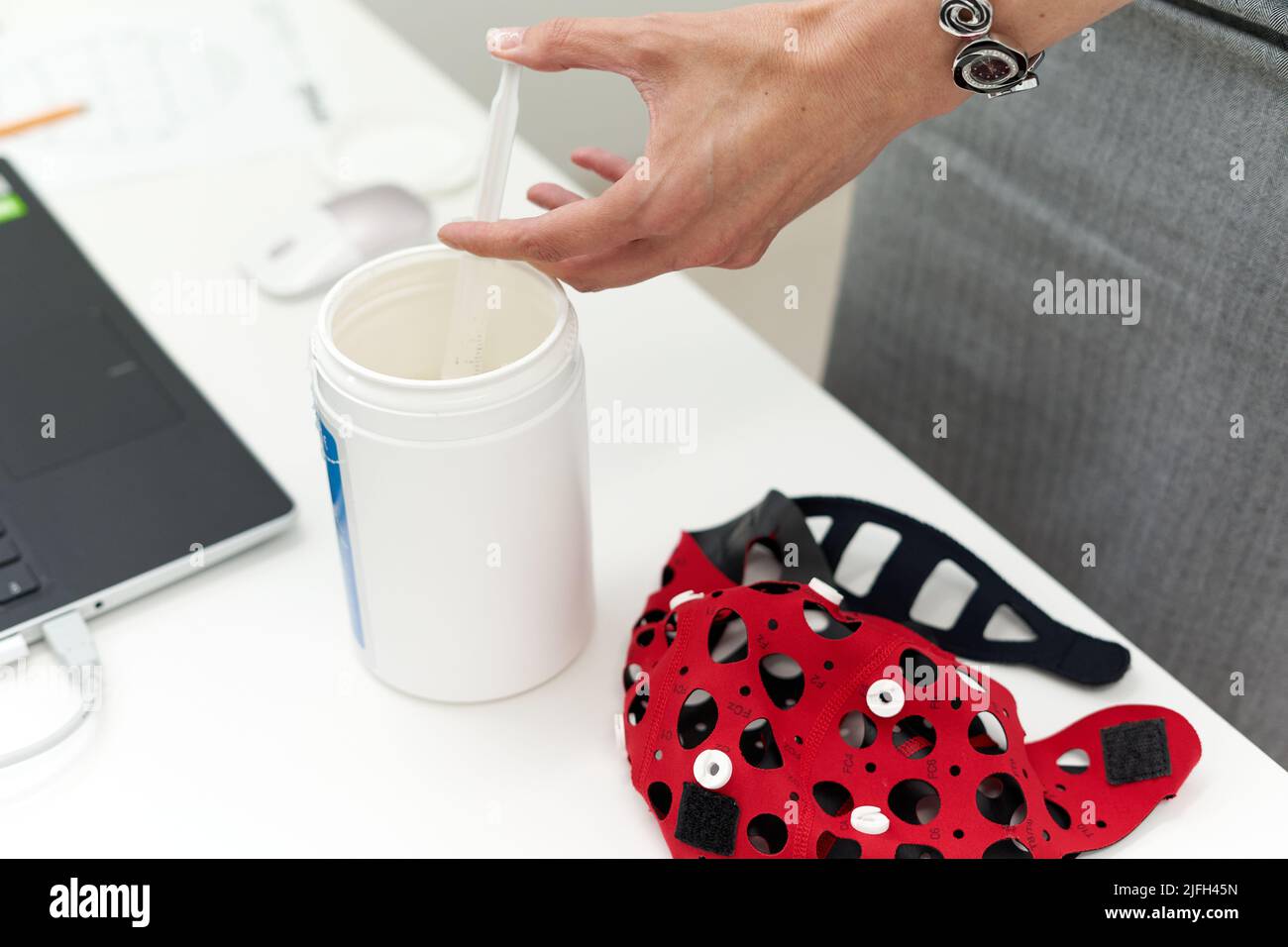 Doctor preparing material for a biofeedback session Stock Photo
