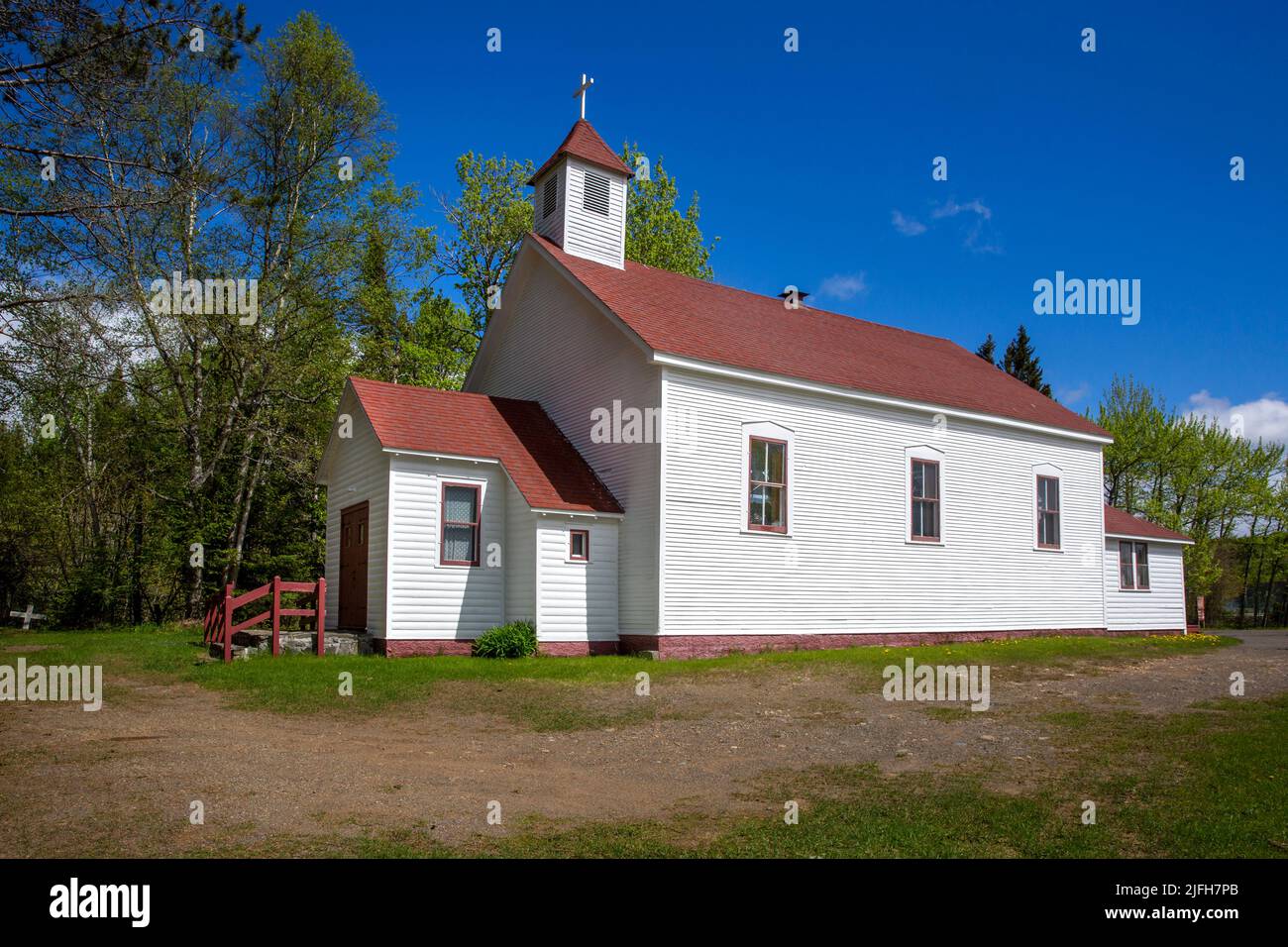 The historic 1865 Holy Rosary Catholic Church on the Grand Portage Anishinaabe Reservation, Minnesota.  The church building is the oldest log cabin ch Stock Photo