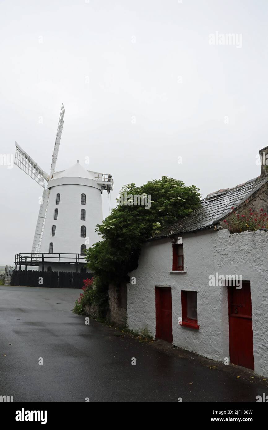 Traditional workmans cottage next to Blennerville Windmill in County Kerry Stock Photo