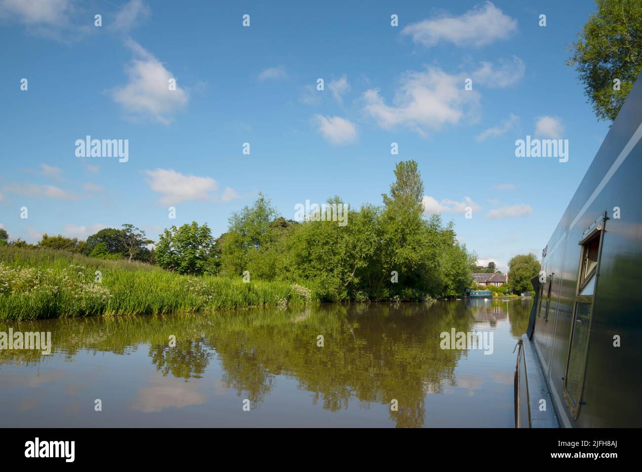 Along the side of a moored narrow boat on the Shropshire Union canal Stock Photo
