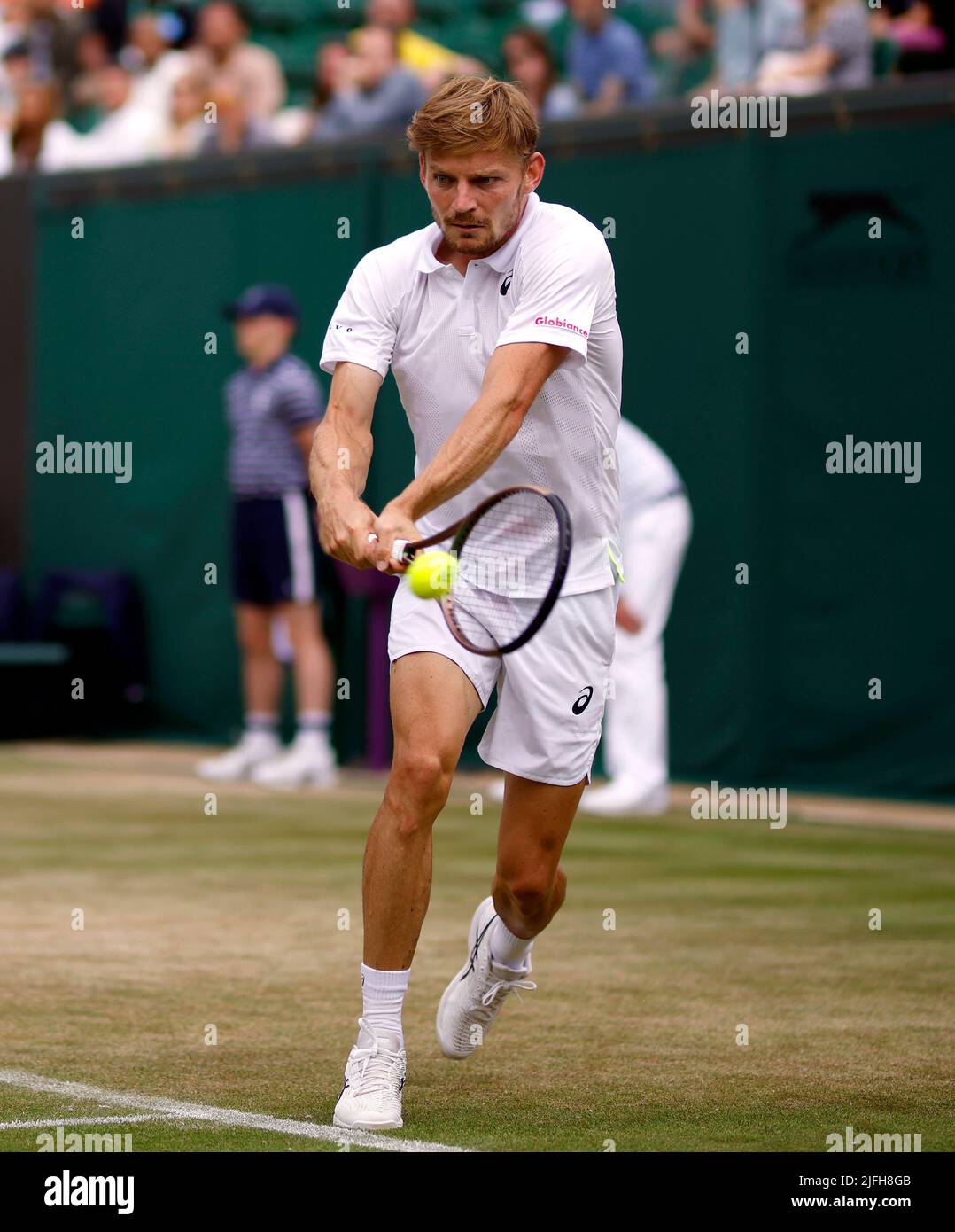 David Goffin in action during his Gentlemens Singles fourth round match against Frances Tiafoe on day seven of the 2022 Wimbledon Championships at the All England Lawn Tennis and Croquet Club, Wimbledon.