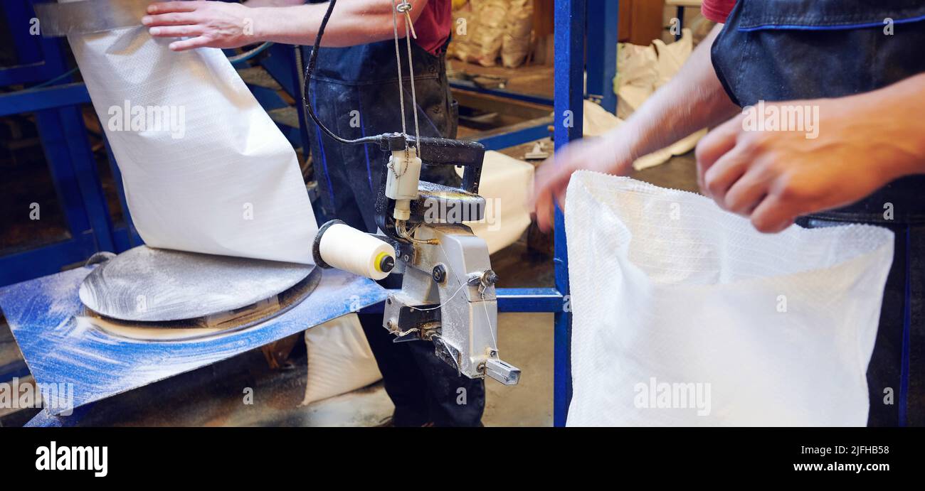 Packing in plastic bag production line close up view Stock Photo Alamy