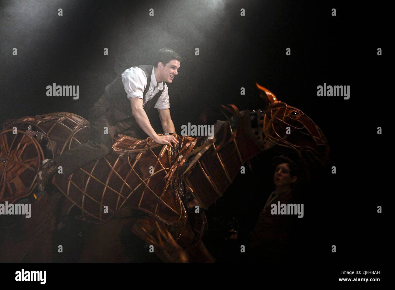 Kit Harington (Albert Narracott) in WAR HORSE at the New London Theatre, London WC2  03/04/2009  based on the novel by Michael Morpurgo  adapted by Nick Stafford  a National Theatre production in association with Handspring Puppet Company  set design: Rae Smith  puppet design and fabrication: Adrian Kohler  lighting: Paul Constable  movement & choreography: Toby Sedgwick  directors: Marianne Elliott & Tom Morris Stock Photo
