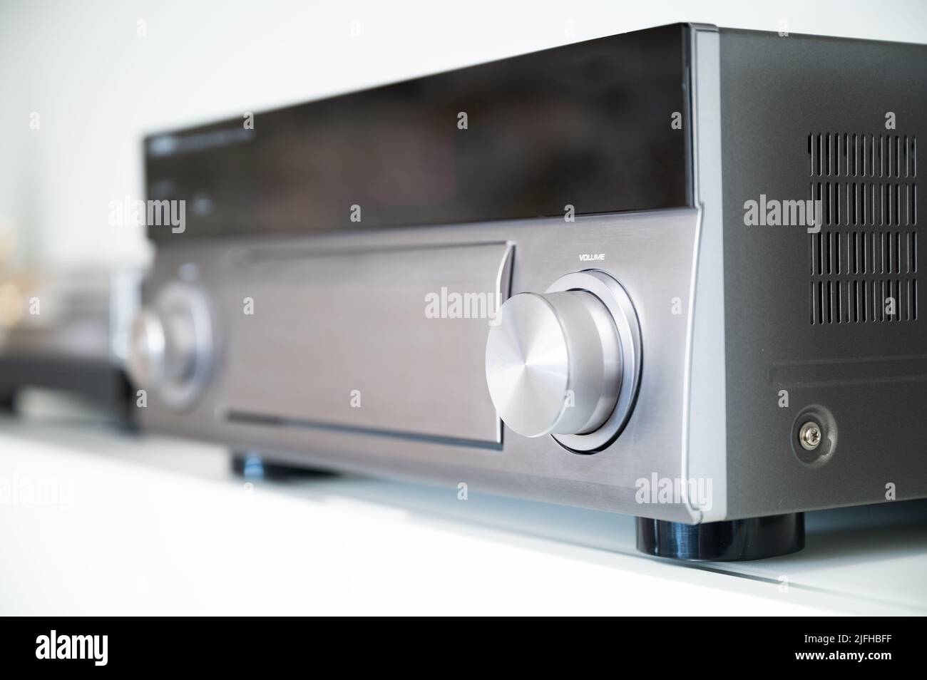 AV receiver with volume knob on a HiFi system Stock Photo