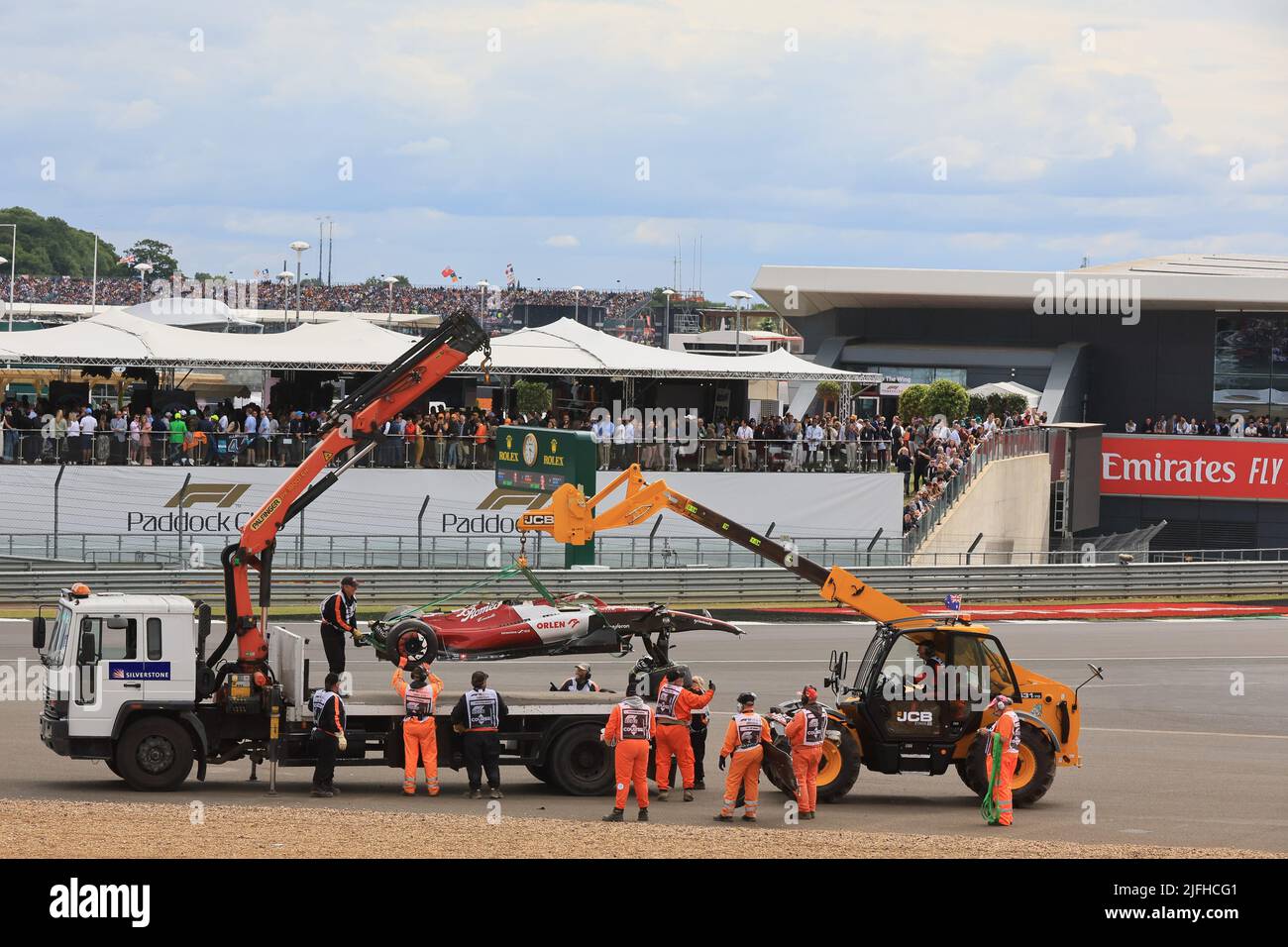 Silverstone, UK. 3rd July 2022, Silverstone Circuit, Silverstone, Northamptonshire, England: British F1 Grand Prix, Race day: Alfa Romeo; F1 Team; Orlen, Guanyu Zhou car is removed Credit: Action Plus Sports Images/Alamy Live News Stock Photo