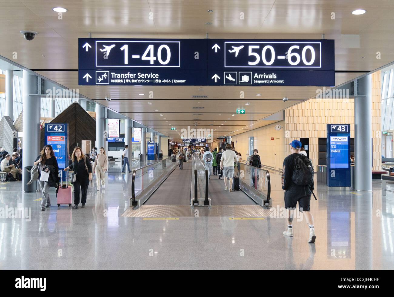 Air passengers going to gate, terminal interior, Helsinki airport, Helsinki Finland Europe Stock Photo