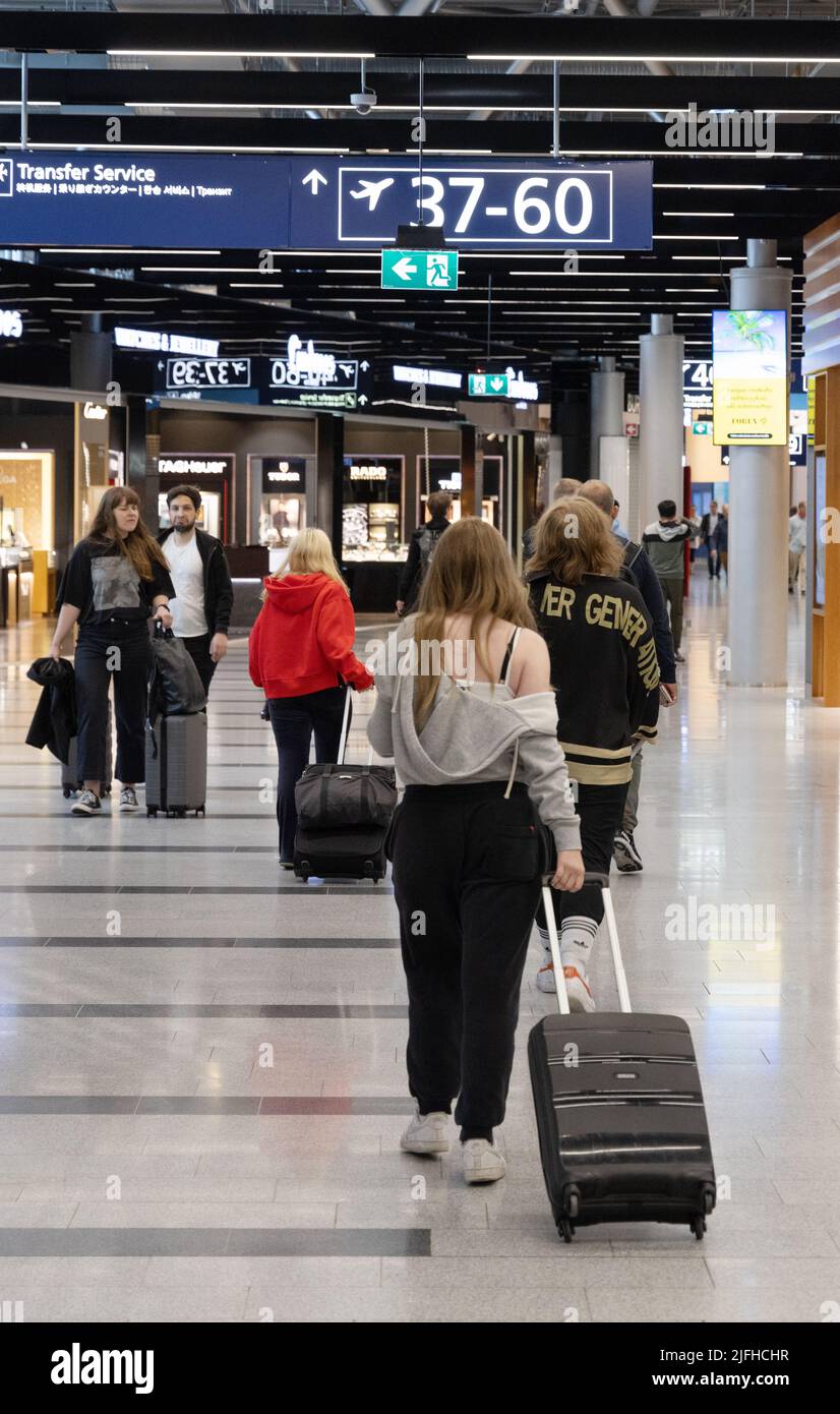 Air passengers going to gate, terminal interior, Helsinki airport, Helsinki Finland Europe Stock Photo