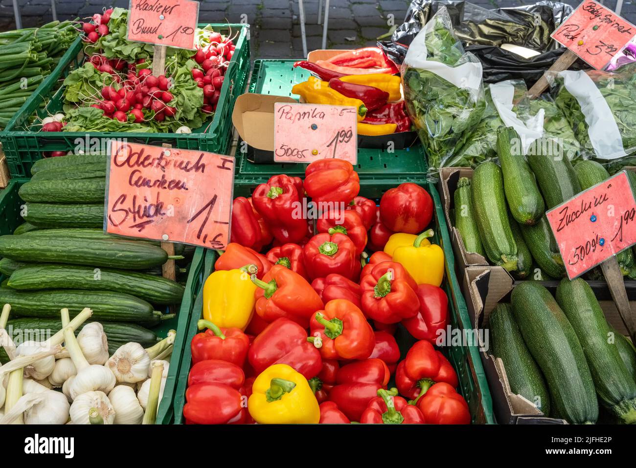Bell pepper, cucumber and courgette for sale at a market Stock Photo