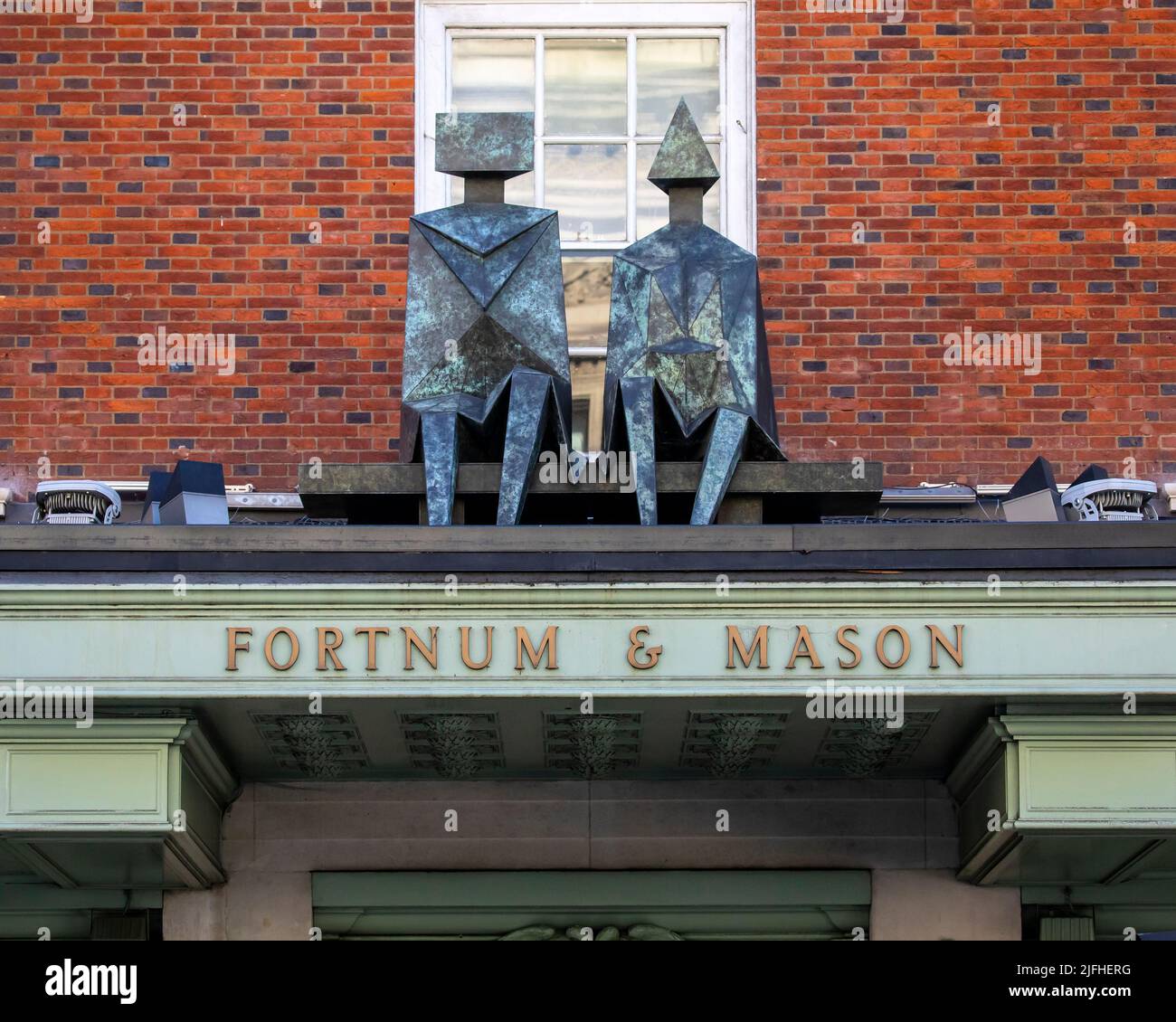 London, UK March 8th 2022 A sculpture and sign above the entrance to