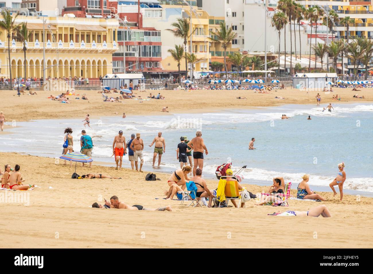 Las Palmas, Gran Canaria, Canary Islands, Spain. 3rd July, 2022. Tourists, many from the UK, on the city beach in Las Palmas on Gran Canaria; a popular holiday destination for many UK holidaymakers. Flight cancellations and staff shortages at some UK airports are expected to cause disruption throughout the summer. Credit: Alan Dawson/ Alamy Live News. Stock Photo