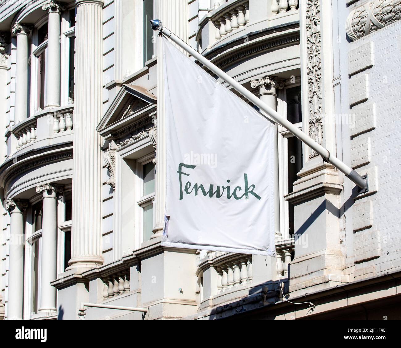London, UK - March 8th 2022: Fenwick banner above the entrance to the Fenwick department store on New Bond Street in the Mayfair area of London, UK. Stock Photo