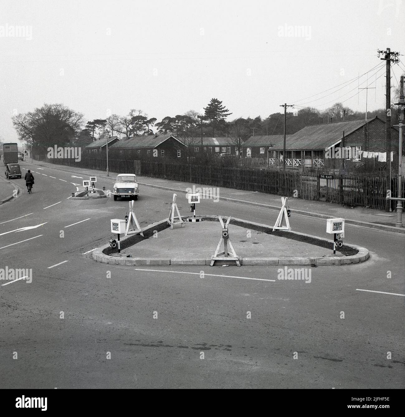 1960s, historical, newly built triangular road lay-out or junction on Slade Rd, Oxford, England, UK. Seen in the picture on the right are the former Army camps off The Slade which provided much-needed housing for families in the post-war period. Stock Photo
