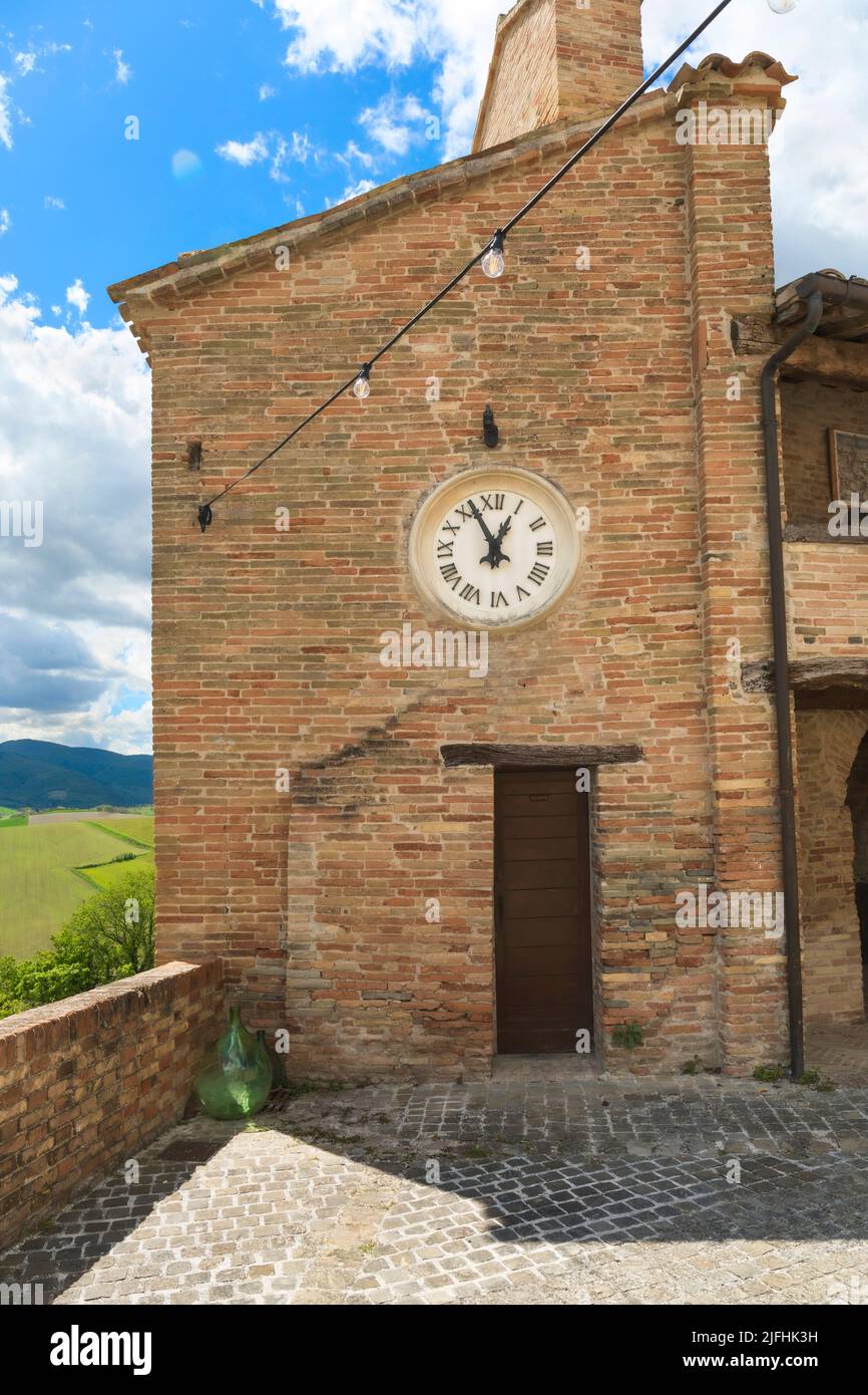 Castello di Loretello, Italy - April 24, 2022: view from the square of the castle,  building with clock Stock Photo
