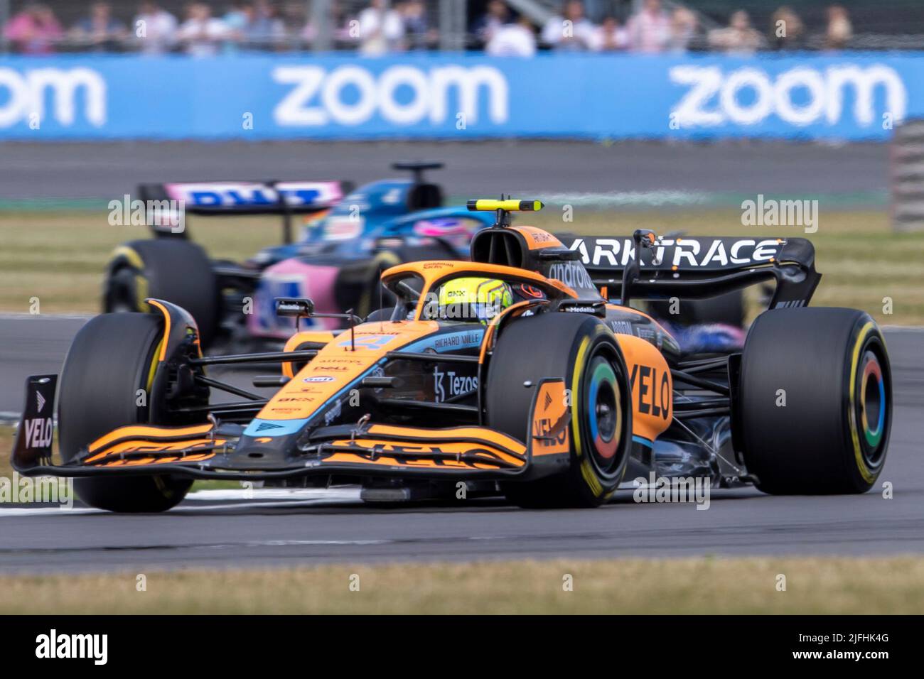 Silverstone, UK. 3rd July 2022,  Silverstone Circuit, Silverstone, Northamptonshire, England: British F1 Grand Prix, Race day: McLaren F1 Team driver Lando Norris in his McLaren-Mercedes MCL36 ahead of BWT Alpine F1 Team driver Fernando Alonso in his Alpine-Renault A522 at the restart of the race Credit: Action Plus Sports Images/Alamy Live News Stock Photo