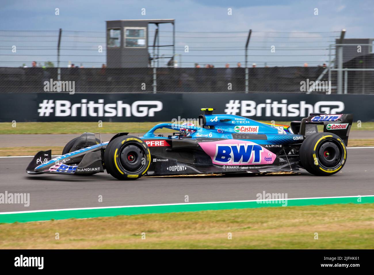 Silverstone, UK. 3rd July 2022, Silverstone Circuit, Silverstone, Northamptonshire, England: British F1 Grand Prix, Race day: Sparks fly from the damaged car of BWT Alpine F1 Team driver Esteban Ocon in his Alpine-Renault A522 Credit: Action Plus Sports Images/Alamy Live News Stock Photo