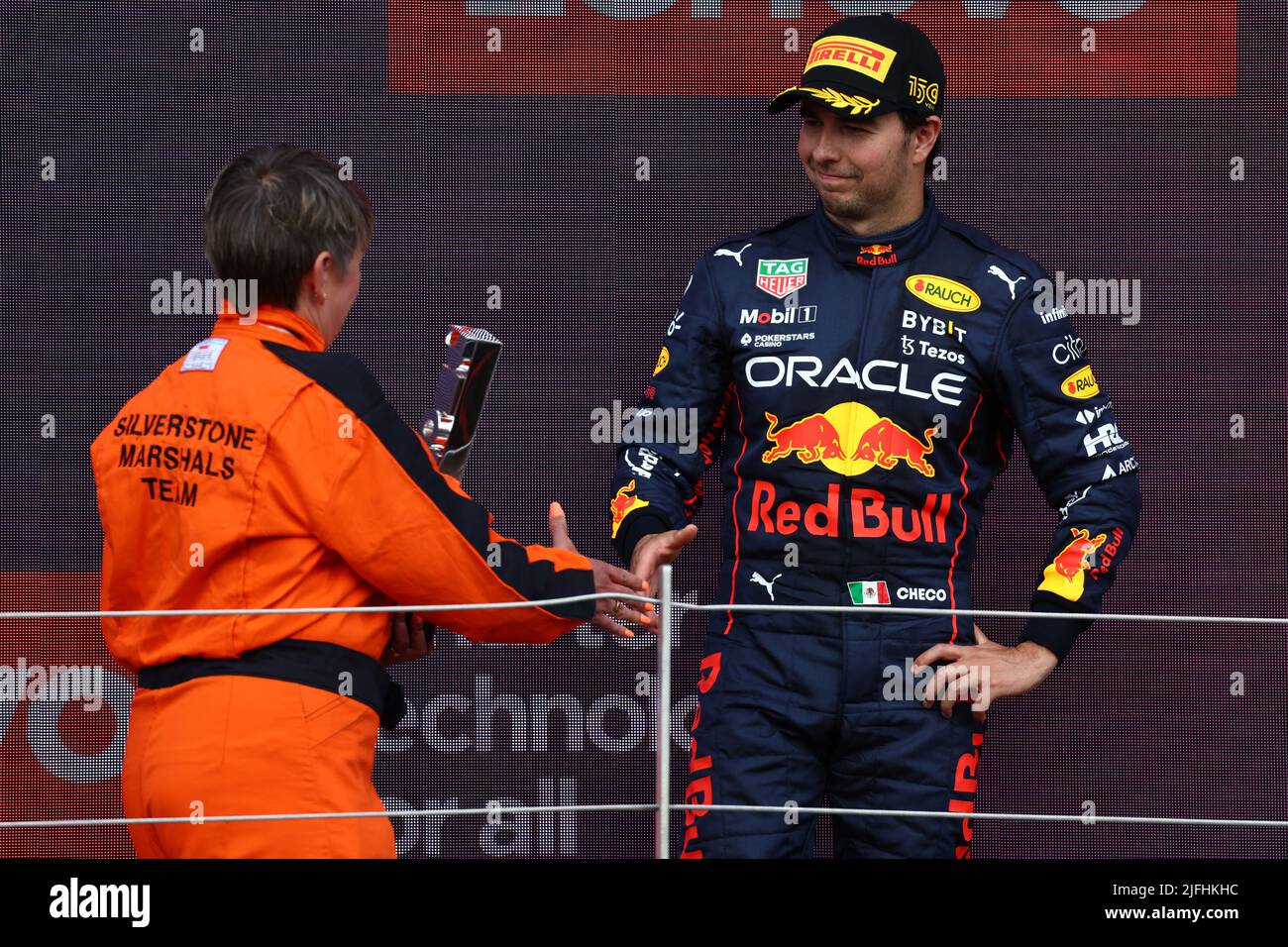 Silverstone, UK. 03rd July, 2022. Sergio Perez (MEX) Red Bull Racing celebrates his second position on the podium with Nadine Lewis (GBR) British Motorsports Marshals Club Chai. 03.07.2022. Formula 1 World Championship, Rd 10, British Grand Prix, Silverstone, England, Race Day.  Photo credit should read: XPB/Press Association Images. Credit: XPB Images Ltd/Alamy Live News Stock Photo