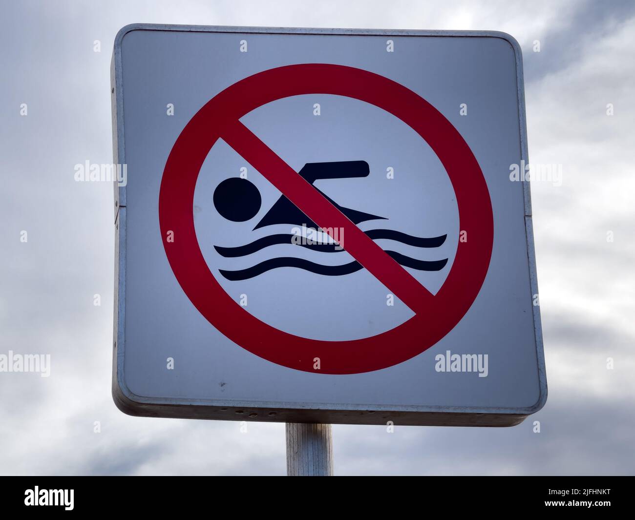 No Simming No swimming warning sign with blue sky Stock Photo - Alamy