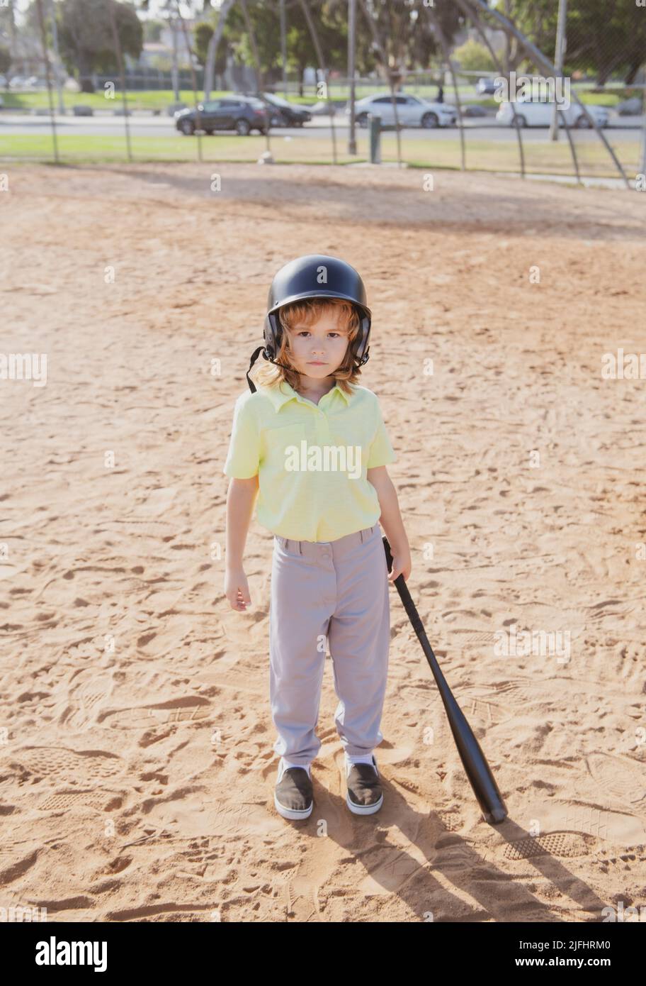 Funny kid baseball player in baseball helmet and baseball bat Stock ...