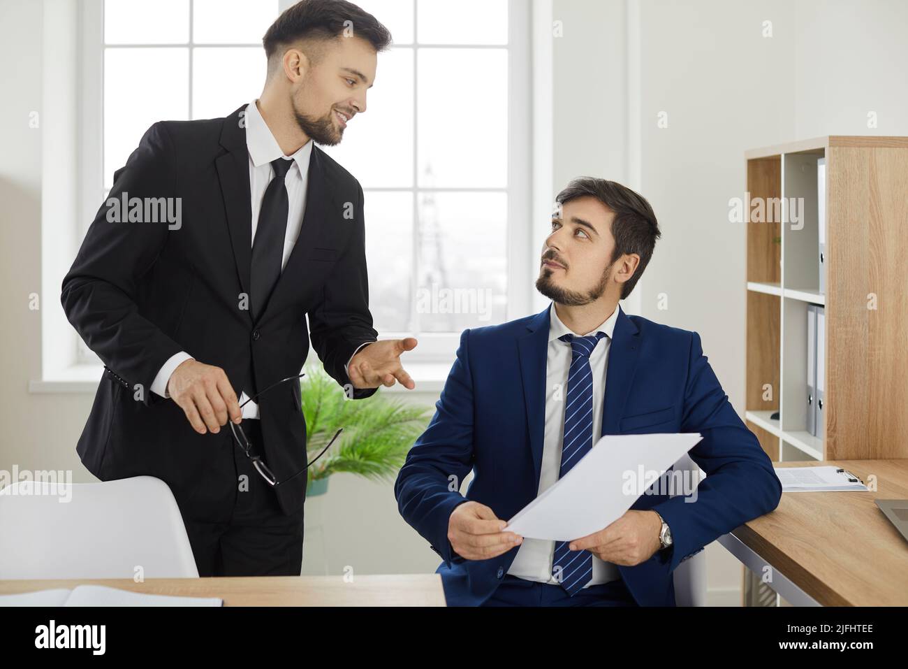 Insurance or real estate agent meeting with client for consultation and discussion Stock Photo