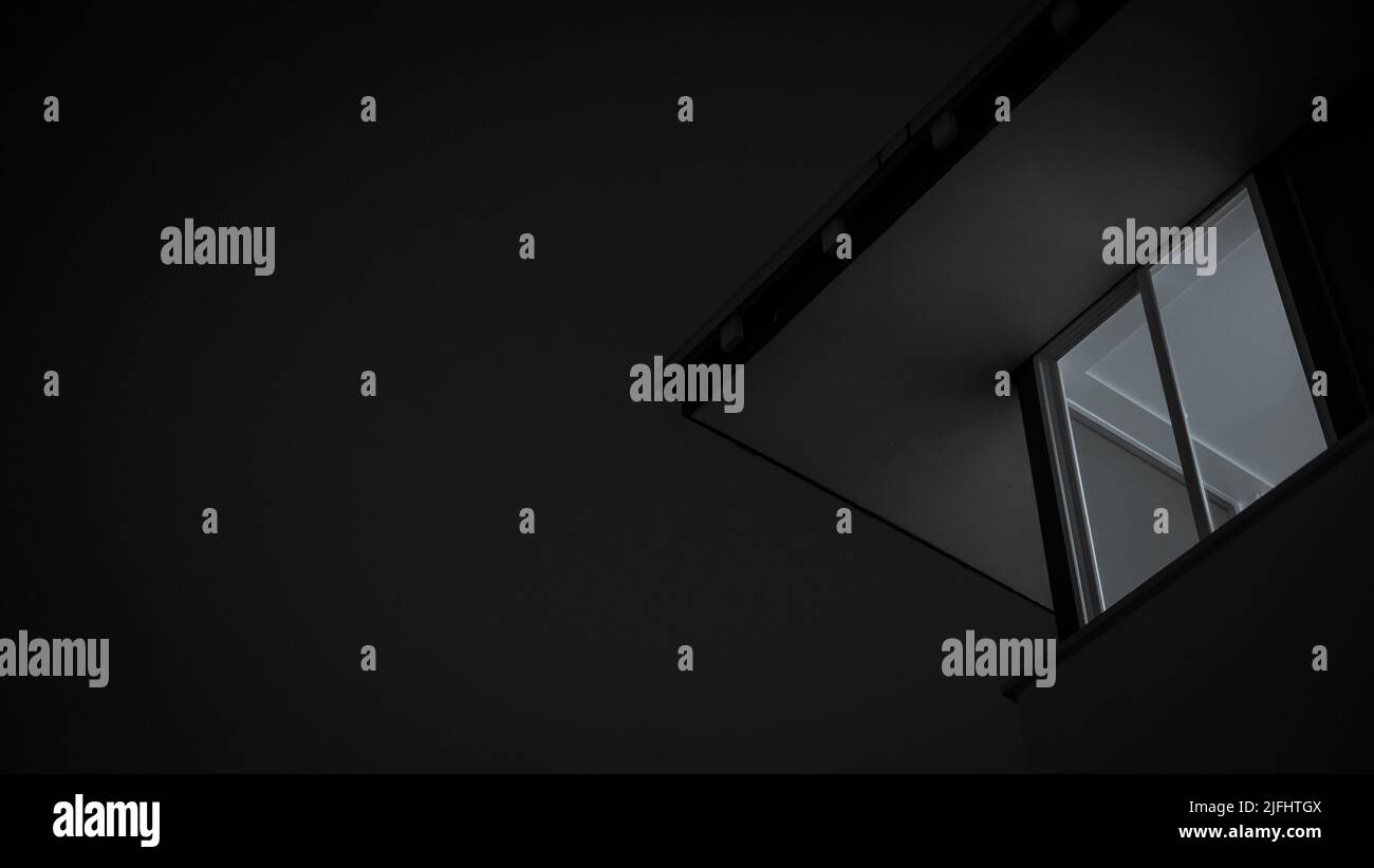 A low-angle shot of a window in grayscale - backdrop with space for ...
