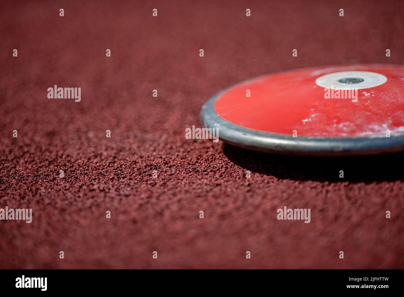 Professional discus on the track and field stade. Horizontal sport