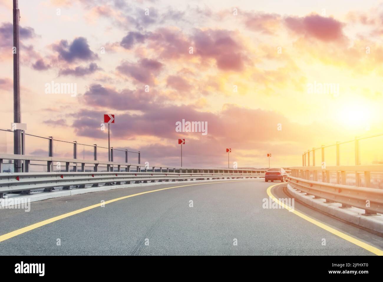 Signal to turn right at the exit from the bypass city highway, evening