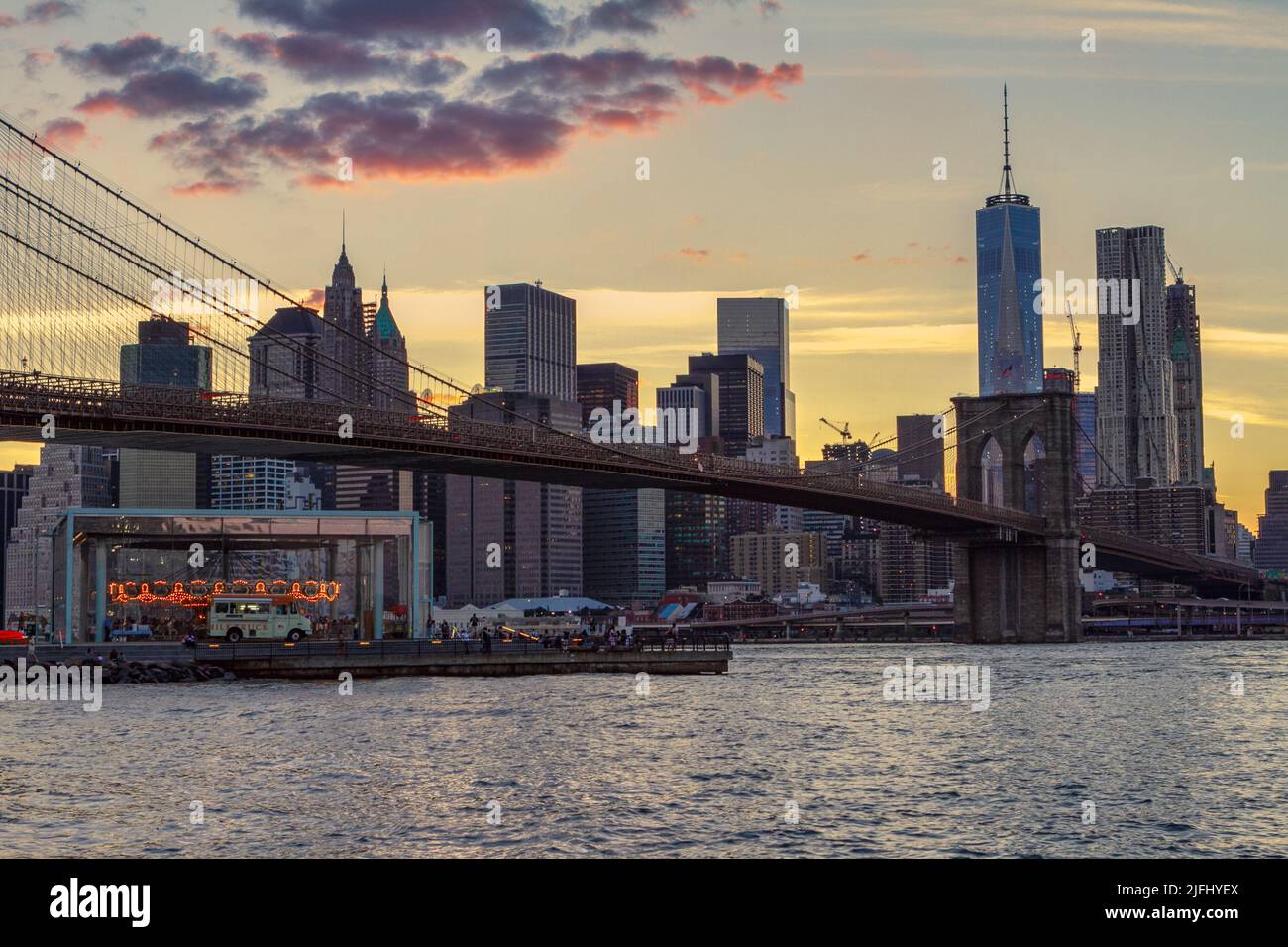 Brooklyn Bridge with Manhattan skyline at dusk Stock Photo - Alamy