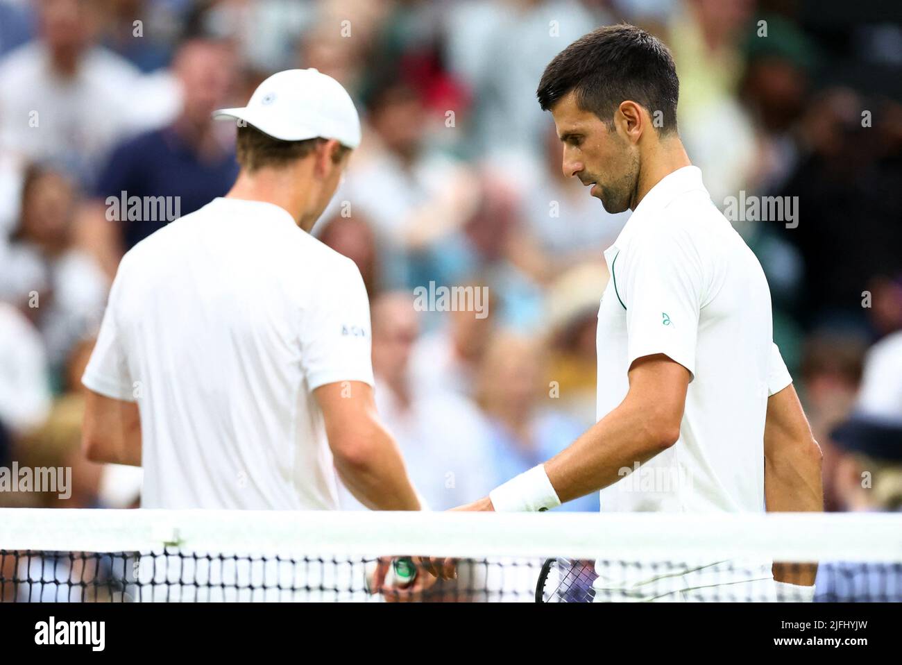 Tennis - Wimbledon - All England Lawn Tennis and Croquet Club, London, Britain - July 3, 2022 Serbia's Novak Djokovic and Netherlands' Tim van Rijthoven during their fourth round match REUTERS/Hannah Mckay Stock Photo