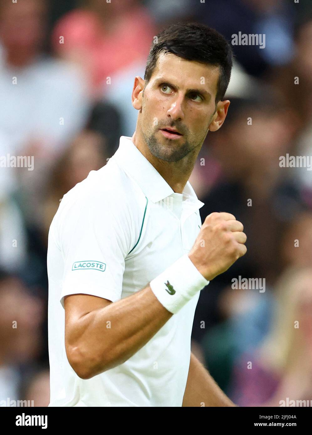 Tennis - Wimbledon - All England Lawn Tennis and Croquet Club, London, Britain - July 3, 2022 Serbia's Novak Djokovic reacts during his fourth round match against Netherlands' Tim van Rijthoven REUTERS/Hannah Mckay Stock Photo