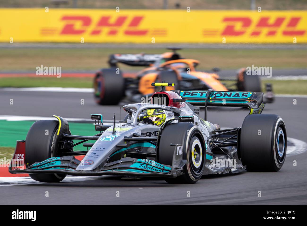Silverstone, UK. 3rd July 2022, Silverstone Circuit, Silverstone, Northamptonshire, England: British F1 Grand Prix, Race day: Mercedes-AMG Petronas F1 Team driver Lewis Hamilton in his Mercedes F1 W13 ahead McLaren F1 Team driver Daniel Ricciardo in his McLaren-Mercedes MCL36 Credit: Action Plus Sports Images/Alamy Live News Stock Photo