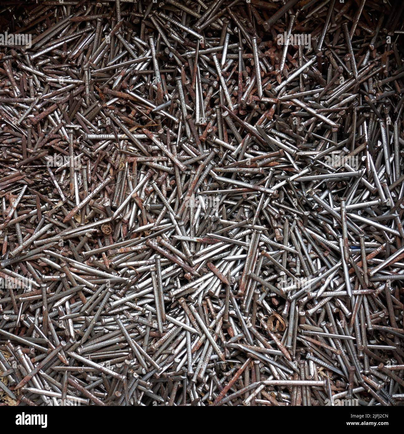 Mixed dense mass of jumble of tarnished nails Stock Photo Alamy