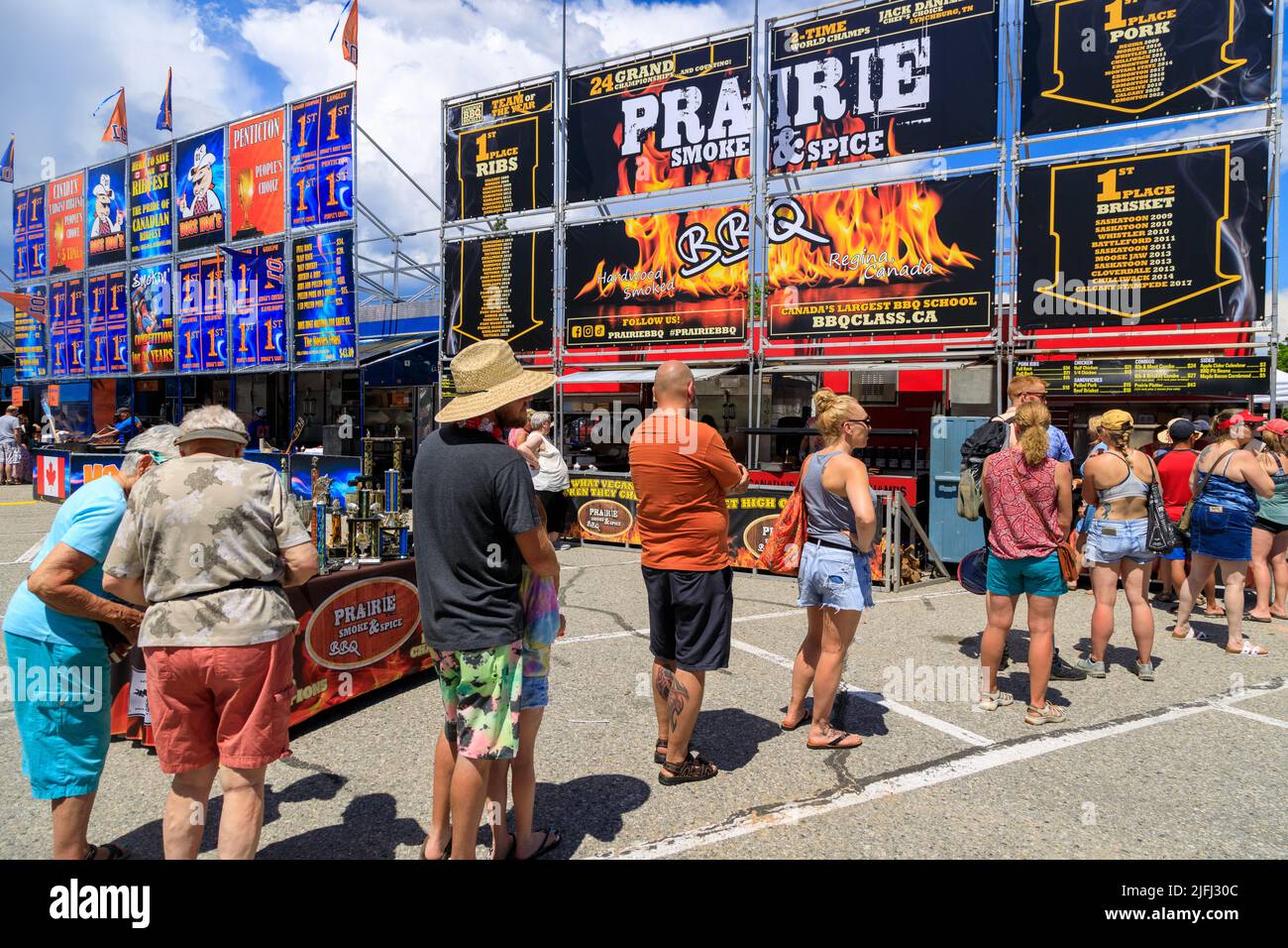 Penticton, British Columbia, Canada - June 30, 2022: Crowds of people at the Penticton Rib Fest where barbecue teams from across Canada compete for be Stock Photo