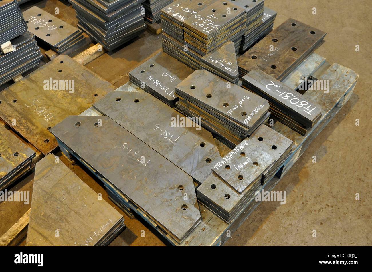 Metal cutting. Warehousing of finished parts with marking. Stock Photo