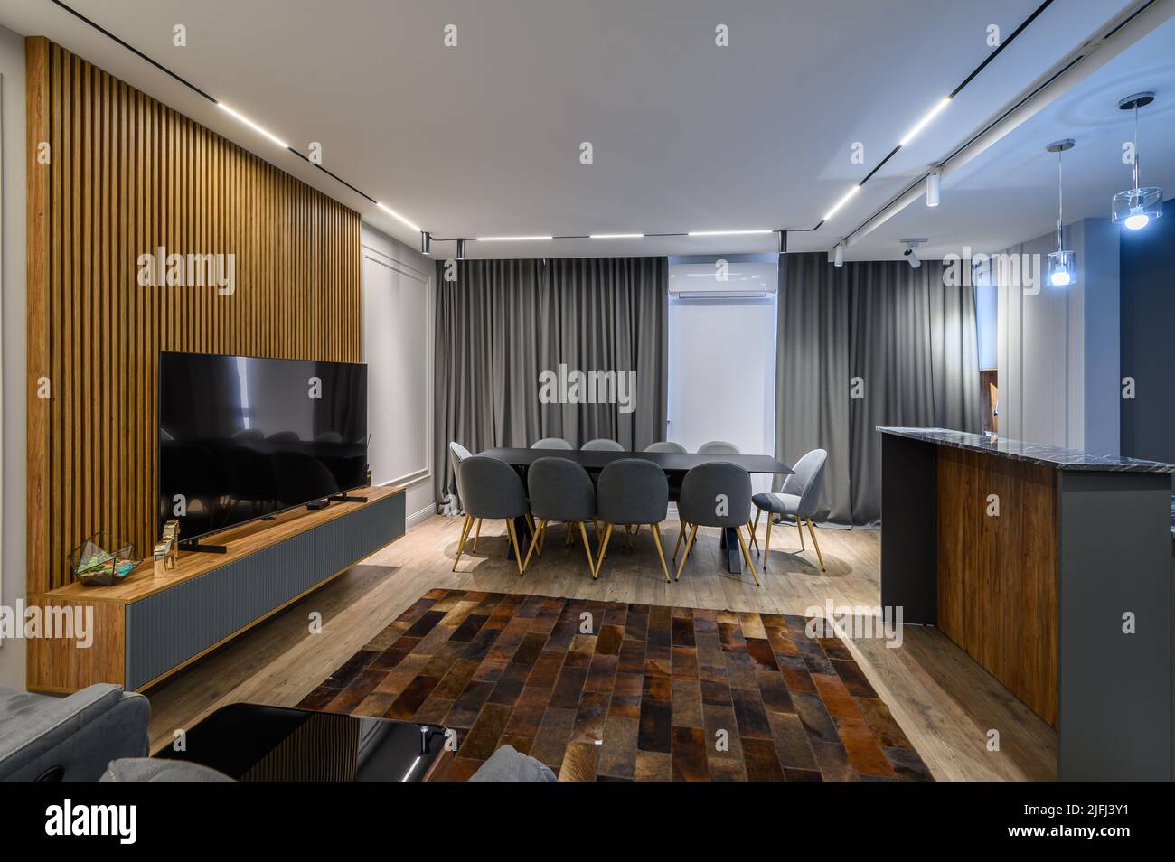 Luxury living room and kitchen in studio apartment Stock Photo - Alamy